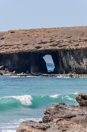 ocean landscape with arch of srone Fuerteventura. Coastline with blue water and rocksの写真素材