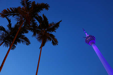 { Illuminated KL Tower } The Menara Kuala Lumpur ((KL Tower) at dusk