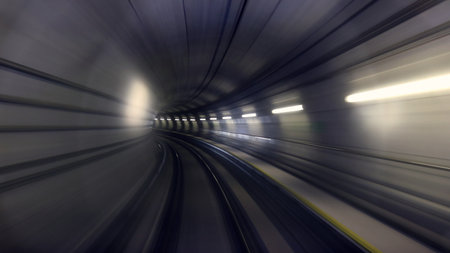 Underground tunnel with moving train. Motion blur. Abstract background.