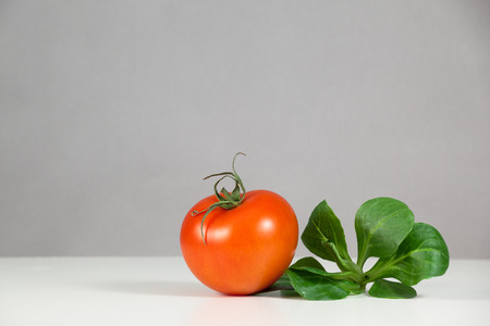 Tomato and salad in the kitchenの写真素材