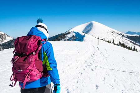 girl walking on snow mountains