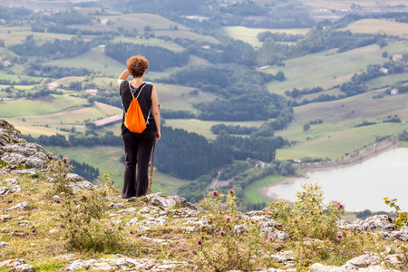 Woman on a summer walk in the mountainsの写真素材