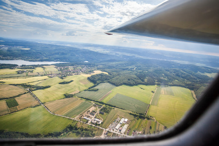 plane flying over countryside