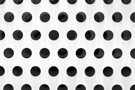 Metal facade, perforated sheet on house backgroundの写真素材