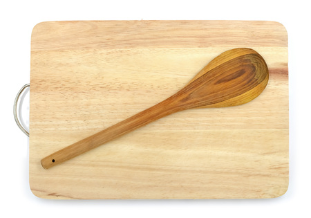 Wooden ladle on chopping blockの写真素材