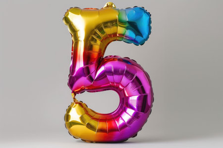 Multi-colored foil balloons in the shape of the numbers 5 on a white background. High quality photoの素材