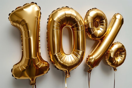 Multi-colored foil balloons in the shape of number 10% on a white backgroundの素材
