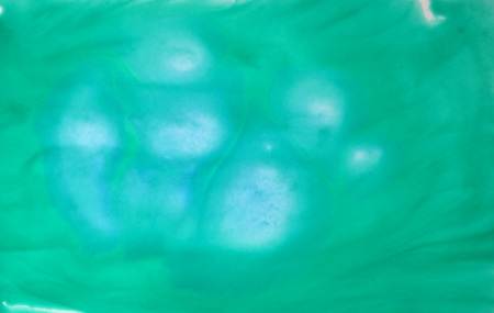 Abstract green watercolor background with water stains