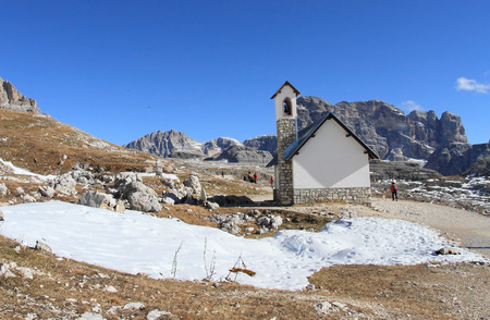 DOLOMITES ITALY  NOV 2 2014: Dolomites and trail to alpine hut Refugio Lavaredo on Nov 2 2014 in Dolomites Italy. It is unesco heritage and landmark stop for climbing the peaks of the Alps.のeditorial素材