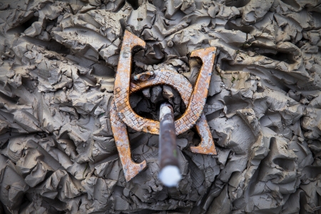 Two horeshoes, double ringer in a clay horseshoe pit 