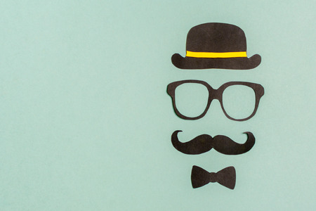 Black paper mustache and glasses on gray background Mock up Flat lay Copy spaceの写真素材