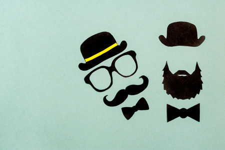 Black paper mustache and glasses on gray background Mock up Flat lay Copy spaceの写真素材