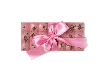 pink fruit chocolate with raisins and nuts isolated on white color background Dessert Time concept...