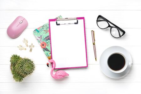 Fashion feminine home office workplace. Tablet, calculator, notepad, golden pen, clips, glasses, cup of coffee, succulent on white wooden background Top view Flat lay Freelance work, business conceptの写真素材