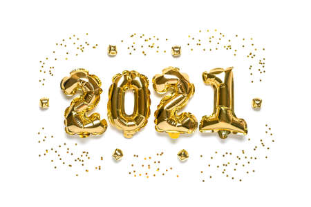 Gold foil balloons numeral 2021 and stars confetti, bells isolated on white background Flat lay composition Top view Happy New year 2021, Merry Christmas concept Holiday card.