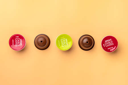 January 2021,Milan, Italy Set of Nescafe Dolce Gusto coffee capsules isolated on white background Top view Flat lay Drink obtained from dosed capsule with roasted, ground, compressed natural coffee.のeditorial素材