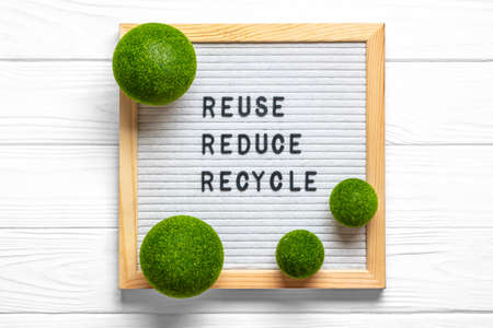 Felt board with quote text Reuse, Reduce, Recycle on white wooden table Top view Flat lay Zero waste, simple life, be green concept.の写真素材