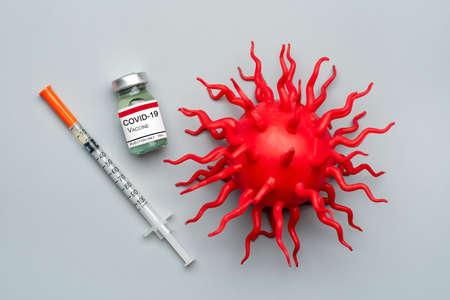 Ampoule with vaccine, syringe isolated on gray background Vaccination against viruses, flu, pneumonia, coronavirus, tuberculosis, covid-19 concept Mock-up Top view Flat Lay.の写真素材