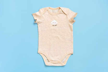 beautiful accessories - clothes for newborn, cotton isolated on blue background Copy space Concept of childhood, motherhood, fashion textile and newborn Top view Flat lay.の写真素材