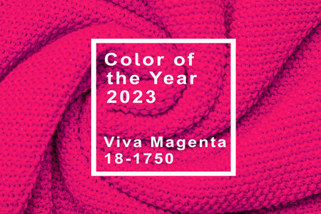 The texture of warm knitted sweater. Beautiful handmade knitted pattern. Demonstrating color of the year 2023 viva magenta.の写真素材