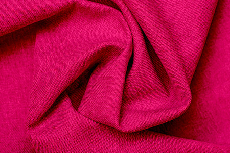texture of fabric. Beautiful knitted repeating pattern. Demonstrating color of the year 2023 viva magenta.の写真素材