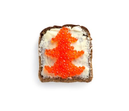 Red caviar on black bread in the form of a Christmas tree on a white background. Sandwich with caviar for the Christmas tableの写真素材