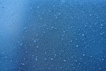 Natural frost , Cool Winter Abstract Ice Glass, Frost background. Ice patterns on glass. Christmas and New year Christmas art design, abstract blue background with ice pattern. Ice on the tapeの写真素材