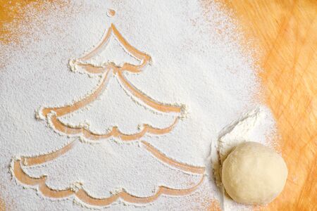 Picture of a tree made from white flour. Merry Christmas and happy new yearの写真素材