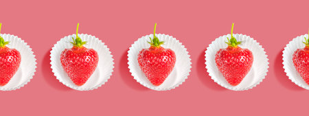Seamless strawberry pattern in white paper basketsの写真素材