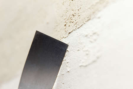 Repair, there is a construction process of patching the wall with a spatula