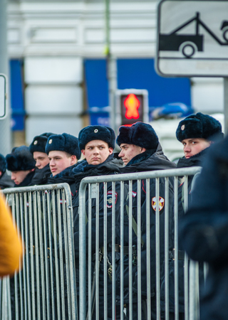 Moscow - Russia, February 25th 2018: police officers behind metallic fence, on the march of Boris Nemtsov, のeditorial素材