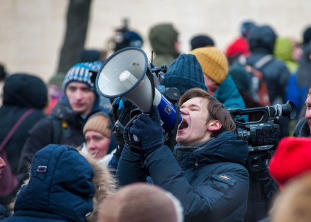 Moscow - Russia, February 25th 2018, young man with the loudspeakerin the crowd of protesters on memorial march of Boris Nemtsovのeditorial素材