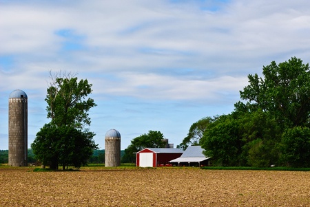 Photo for Barn, Field and Silos Against a Blue Sky on a Midwestern Farm - Royalty Free Image