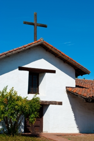 Spanish style church with rustic wooden crossの写真素材