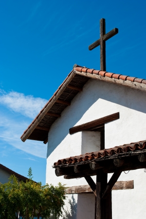 Spanish style church with rustic wooden crossの写真素材