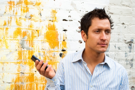 Man in Casual Business Attire Talking on the Phone Outsideの写真素材