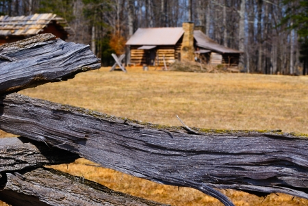 Wooden Log Fence Surrounding a Cabinの写真素材