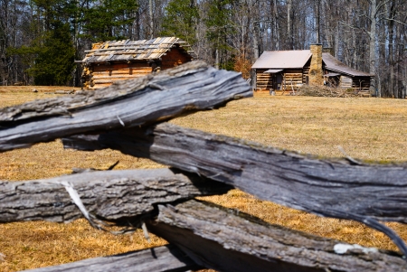 Wooden Log Fence Surrounding a Cabinの写真素材
