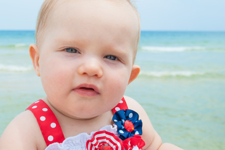 July 4th Patriotic Baby Girl at the Beachの写真素材