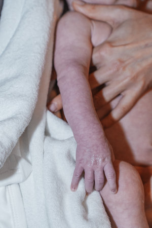 Baby feet being prepared for baptism. A symbol of purity and new life.