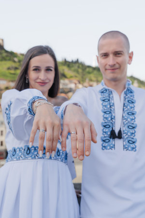 Engagement proposal in Tbilisi: Groom proposing to bride in traditional Ukrainian wedding attire