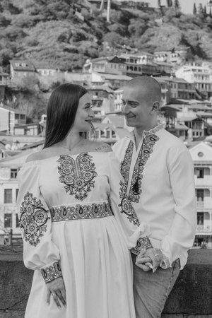Engagement proposal in Tbilisi: Groom proposing to bride in traditional Ukrainian wedding attireの写真素材
