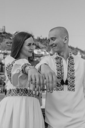 Engagement proposal in Tbilisi: Groom proposing to bride in traditional Ukrainian wedding attireの写真素材