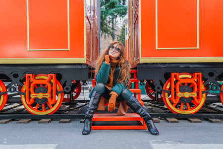 Smiling red-haired woman at a European-style Christmas market during the day, Tbilisi, Georgiaの写真素材