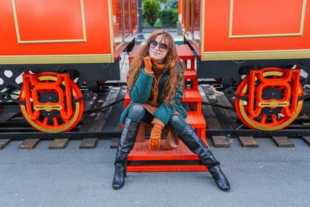 Smiling red-haired woman at a European-style Christmas market during the day, Tbilisi, Georgiaの写真素材