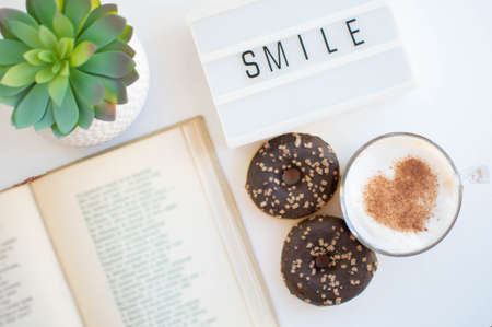 Morning coffee and a poem bookの写真素材