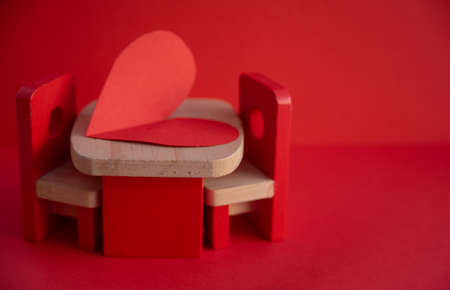 Wooden chairs on a red background. Valentines day concept.の写真素材