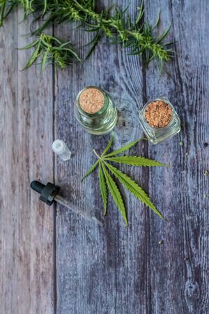 Cannabis herb and leaves for treatment with decoction, tincture, extract, oil. Hemp oil. Selective focus.の写真素材