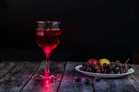 Pink wine. Wine in a glass. Traditional Georgian wine according to ancient technology. Copy space Close-up and horizontal orientation.の写真素材