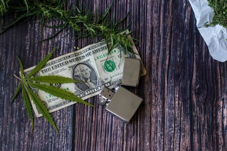 Marijuana leaf for money, dollars and cannabis, legal business and black market business. Cannabis herbの写真素材